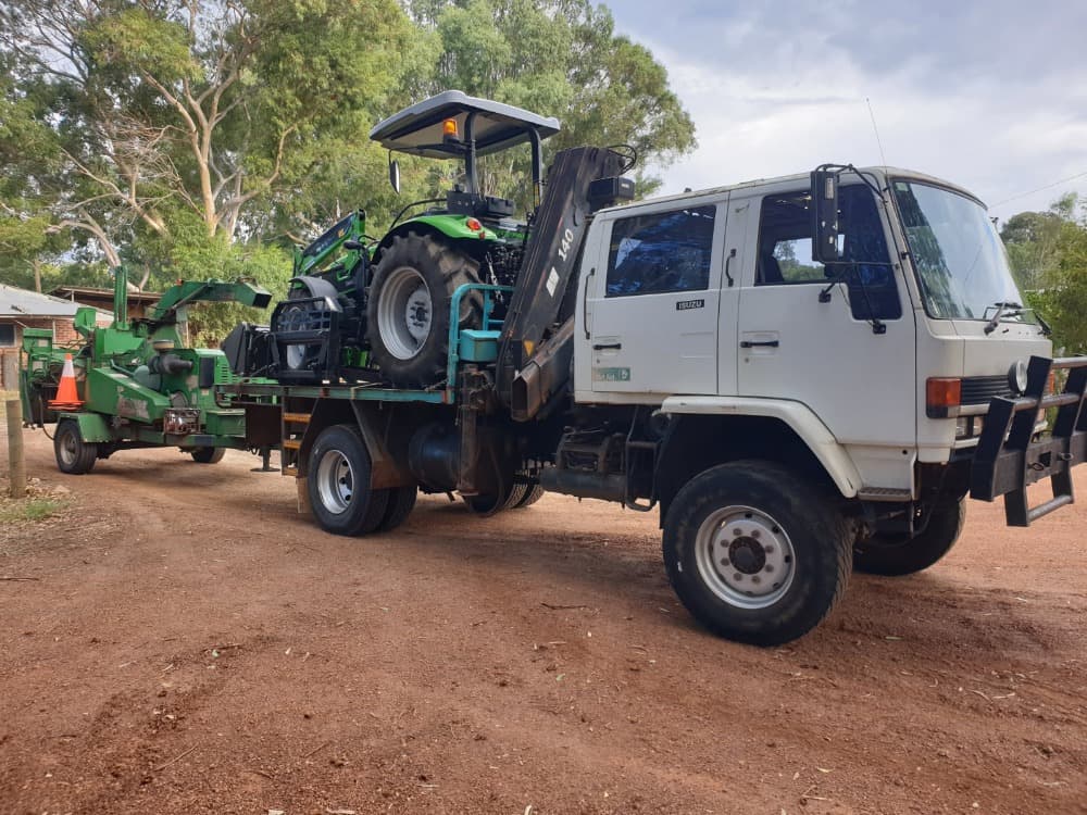 WA Arbor Masters crew with truck, tractor and chipper on site